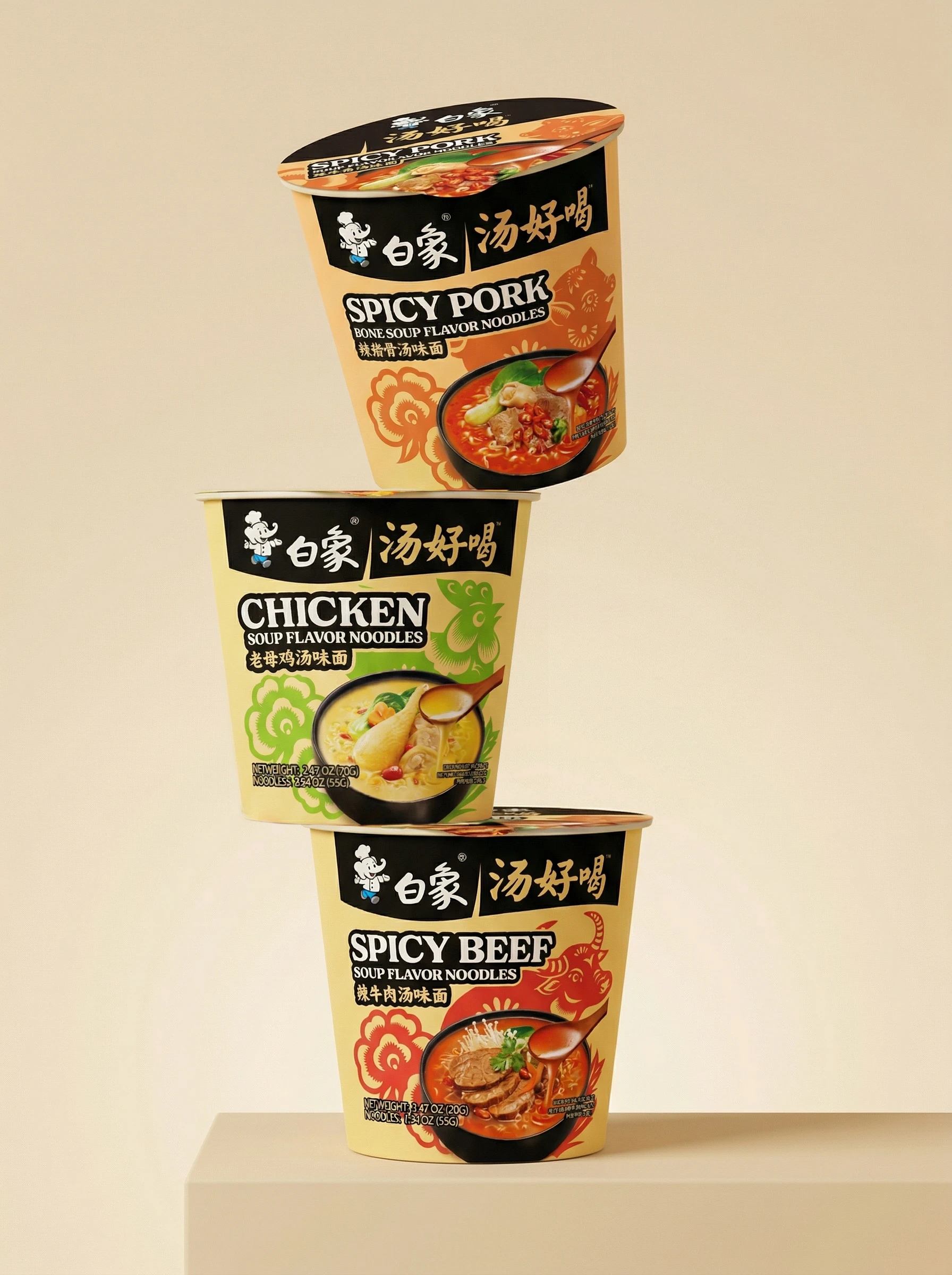 浅米色背景中三杯叠放的白象汤好喝国际版杯面包装